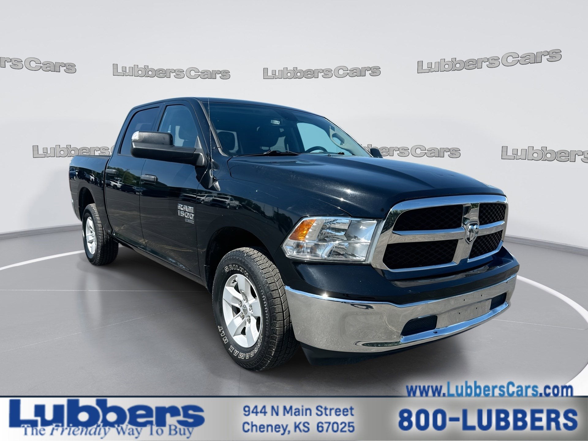 2023 RAM 1500 Classic SLT in Diamond Black Crystal Pearlcoat — front three-quarter view